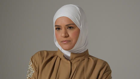 Studio-Head-And-Shoulders-Portrait-Of-Muslim-Woman-Wearing-Hijab